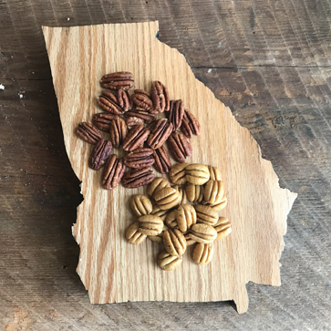 fresh pecans on a wooden board