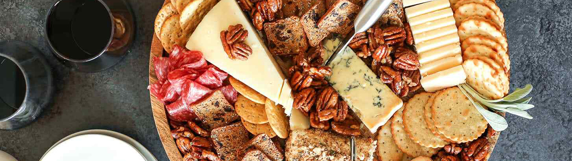 Charcuterie Board with Crackers, Cheese, and Pecans
