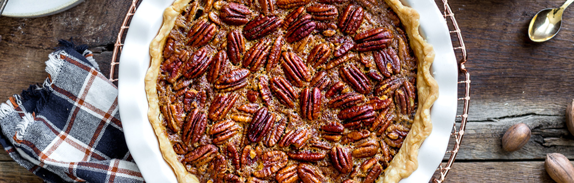 Close Up of Pecan Pie on Wood Table
