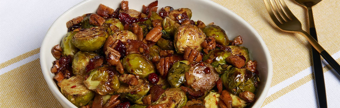 Roasted Brussel Sprouts with Bacon, Cranberries and Pecans in White Bowl