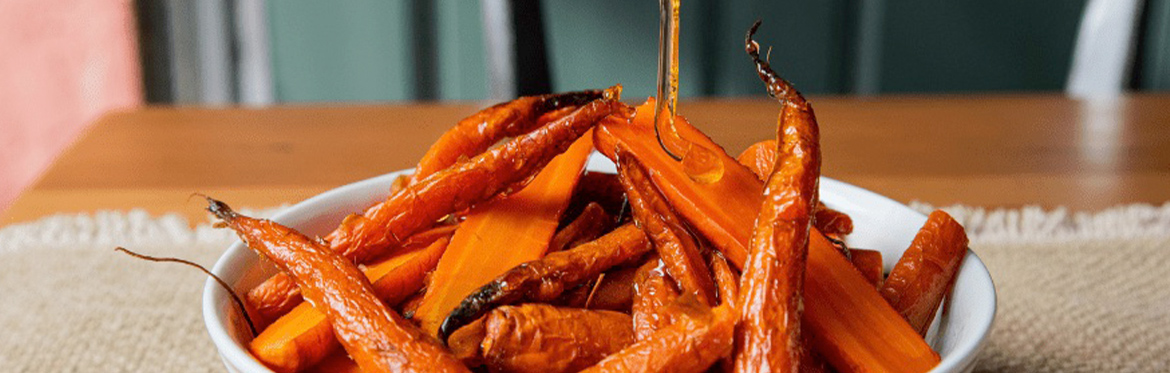 Roasted Carrots with Candied Pecans in Bowl