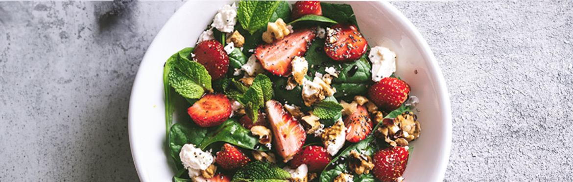 Strawberry and Pecan Salad in White Bowl